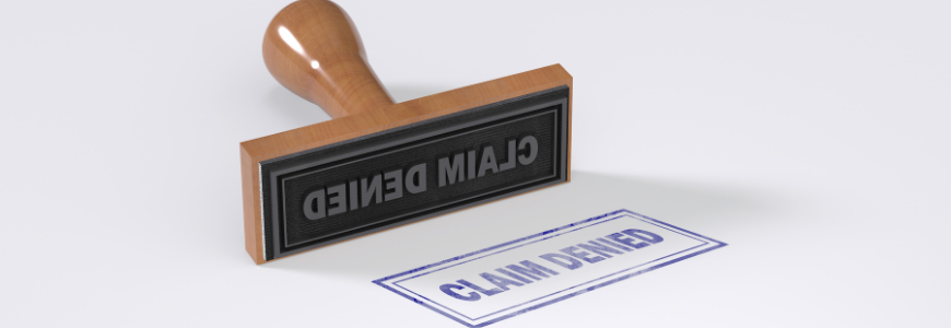 Rubber stamping that says Claim Denied on White Background.