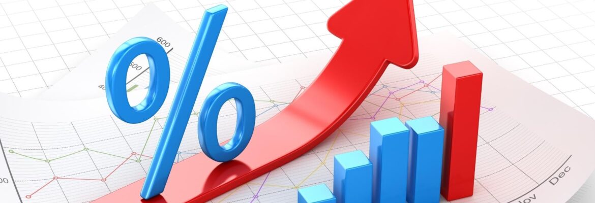 Percent symbol and business chart on financial paper, red arrow moving up.