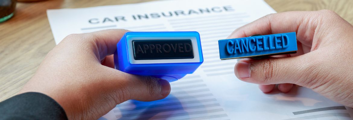 Businesswoman holding approved and cancelled rubber stamp to make a decision on car insurance