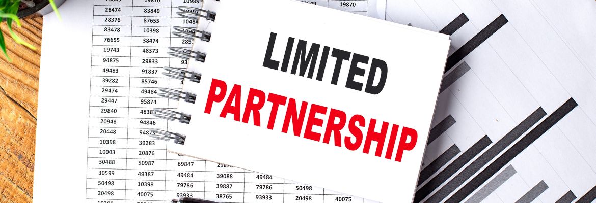 LIMITED PARTNERSHIP text on notebook with chart and calculator