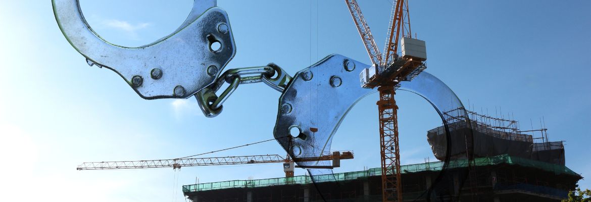 Handcuffs on construction site , crime concept